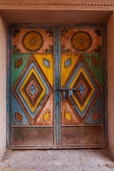 An old iron door with bright colors and One of the famous doors in Nizwa Souq
This photo was taken in the Sultanate of Oman, Nizwa