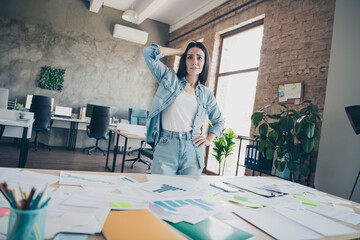 Photo of pretty young girl confused upset analyze graph wear trendy denim outfit modern workplace...