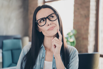 Photo of unsure uncertain lady accountant dressed denim jacket finger chin thinking indoors...