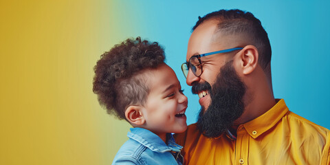 Joyful African American Father and Son Laughing Against Colorful Background