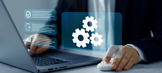 Engineer setting up automated software.Automated industrial technology with digital...