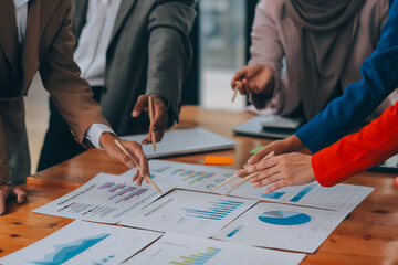 Business professionals. Group of young confident business people analyzing data using computer while spending time in the office
