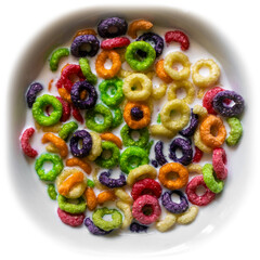 Breakfast of colored corn flakes. Multi-colored delicious corn rings with milk