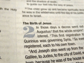Close up of text in the Gospels of the Bible, recounting the birth and existence of Jesus