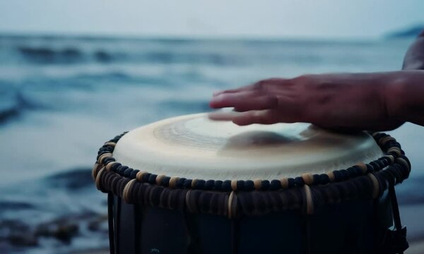  Percussionist hands playing atabaque. Tribute to Iemanja