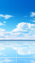 Vast, clear sky reflected on a tiled floor.
