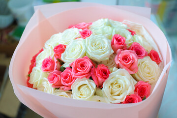 Gift wedding bouquet of white, yellow and red roses