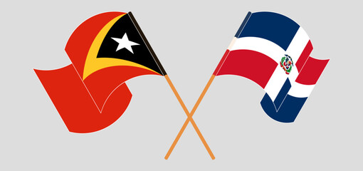 Crossed and waving flags of East Timor and Dominican Republic