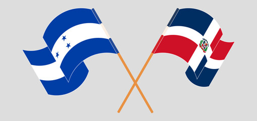 Crossed and waving flags of Honduras and Dominican Republic