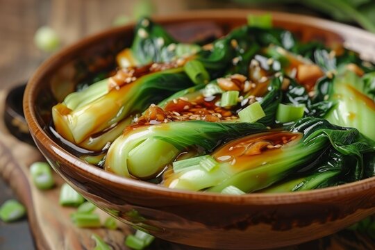 Chinese dish with bok choy in oyster sauce and garlic focused on