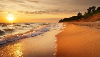 golden sunset on a wide sandy beach along the coast of lake michigan as waves crash onto the shore