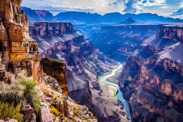 Stunning view of a majestic canyon with a winding river, bathed in diverse, natural colors.