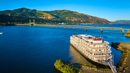 Aerial View of river boat by Hood River Bridge in Columbia Gorge