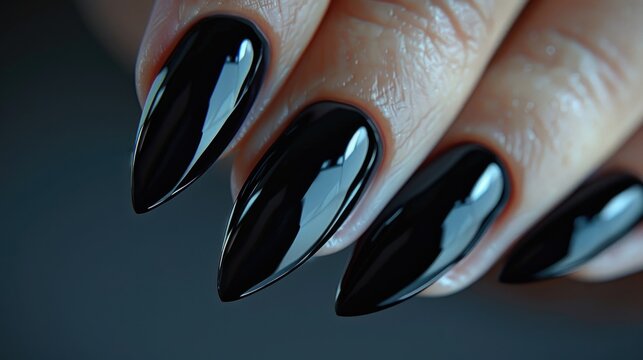 A close-up view of a person's nails with black nail polish, ideal for beauty or fashion-related uses