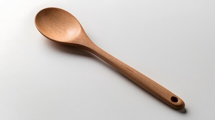 Concept photo of top view of a wooden spoon on white background with space for text