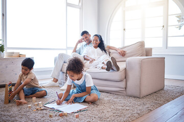 Relax, parents and children drawing in home for learning, homework or education activity. Rest, bonding and kids playing with building blocks, book and abacus with mom and dad on sofa in living room.