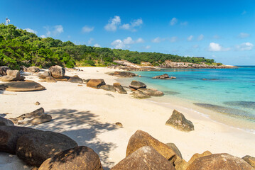 Picturesque tropical golden sandy Sunset Beach with turquoise water on Lizard Island, Australia. Lizard Island  is located on Great Barrier Reef in north-east part of Queensland