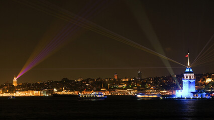 A night and long exposure photograph captures a synchronized light show between the Maiden's Tower...