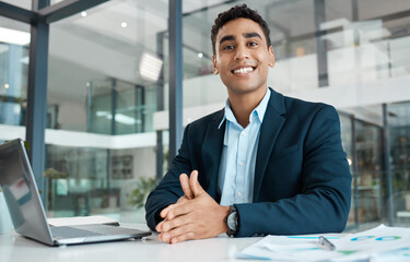 Portrait, financial advisor and smile with laptop at desk for research, planning and stock market. Businessman, hands and trading or happy in office for career, fintech and technology in agency