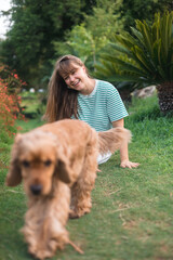 cocker Spaniel dog having fun and playing with young beautiful woman