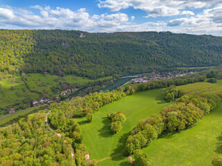 Landscape with fields, mountains and river in France near Besancon in spring, Franche-Comte