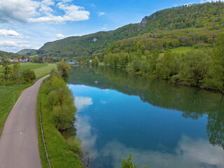 Obraz premium Landscape with fields, mountains and river in France near Besancon in spring, Franche-Comte