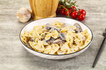 Italian cuisine - farfalle with mushrooms