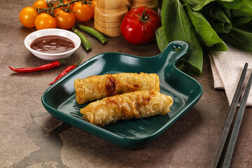 Vietnamese stuffed spring roll served sauce