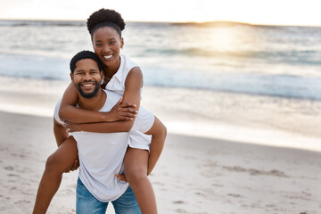 Sunset, black couple and piggyback with portrait, beach and celebrating together for anniversary....