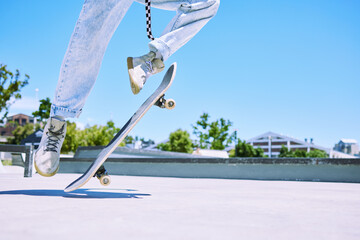 Skateboard, feet and person with skill in city by skating park for competition practice. Hobby,...