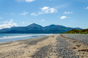 View of the Mourne Mountains from Murlough beach with blue sky and wispy clouds