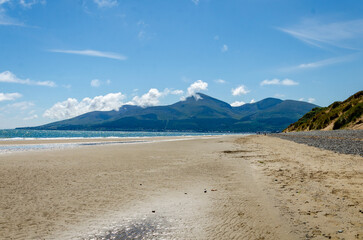 View of the Mourne Mountains from Murlough beach with blue sky and wispy clouds