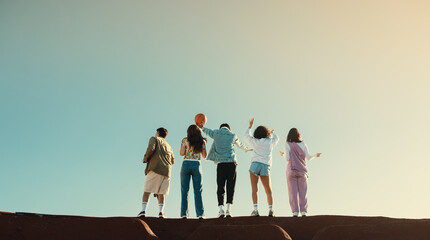 Gen Z friends enjoying a sunny day together, back view