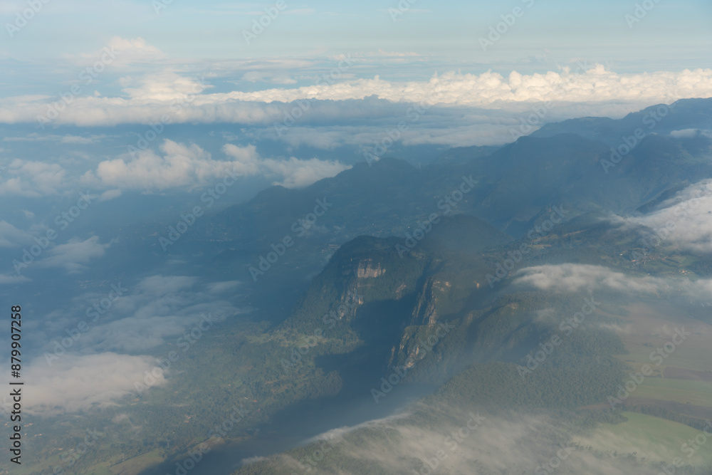 Wall mural Landscape seen from a plane with mountains with fog in Colombia.