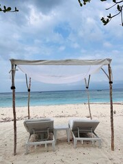 beach chairs and umbrellas on the beach