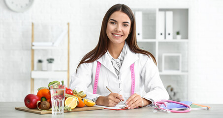 Portrait of female nutritionist in her office