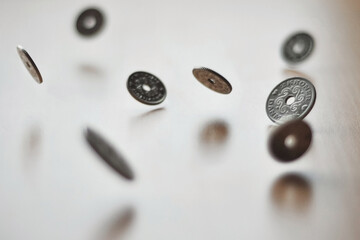 Danish krone DKK coins hovering in the air. Currency rates changes. Abstract idea of money - growth and inflation.