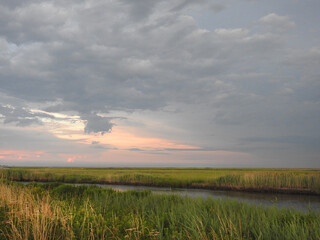 The natural beauty of the wetlands within the Bombay Hook National Wildlife Refuge, during a stormy summer day, Kent County, Delaware.