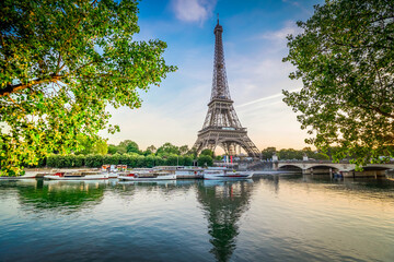 Obraz premium Paris Eiffel Tower and river Seine with sunrise in Paris, France. Eiffel Tower is one of the most iconic landmarks of Paris., toned