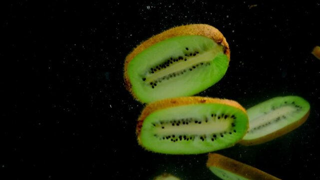 kiwi in the water on a black background