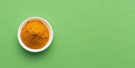 Organic turmeric powder in the bowl - Curcuma longa