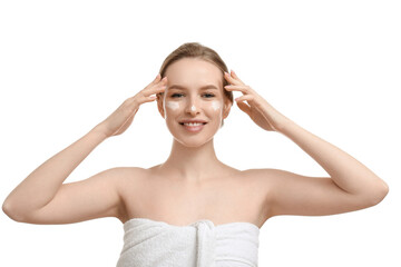 Young woman applying cream on white background