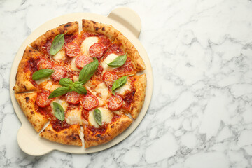 Delicious Margherita pizza on white marble table, top view. Space for text