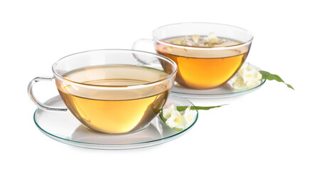Aromatic jasmine tea in cups, flowers and green leaves isolated on white