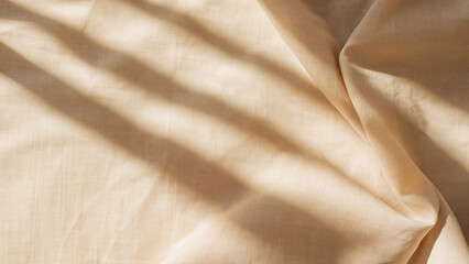 Fototapeta premium Soft Beige Linen Fabric with Natural Light and Shadows