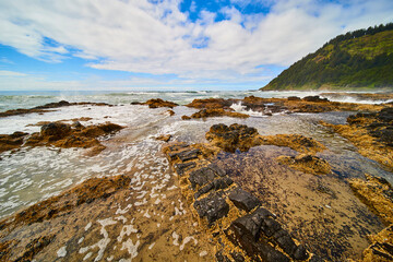 Rugged Coastline and Waves with Lush Hill Aerial Perspective