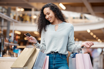 Happy woman, shopping bags and purchase with credit card at mall for payment, swipe or spend money....