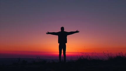 Empowering Silhouette at Sunset - Inspirational Image of Person With Outstretched Arms for Motivational Quotes and Copy Space