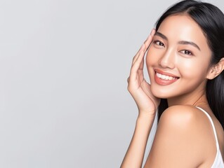 Fototapeta premium Skincare with beautiful Japanese Korean woman in her late thirties, with dark hair and wearing a white sleeveless top. Facial treatment, Cosmetology, Spa, Aesthetic, plastic surgery