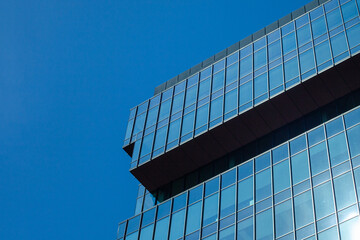 Modern Glass Building Against Blue Sky